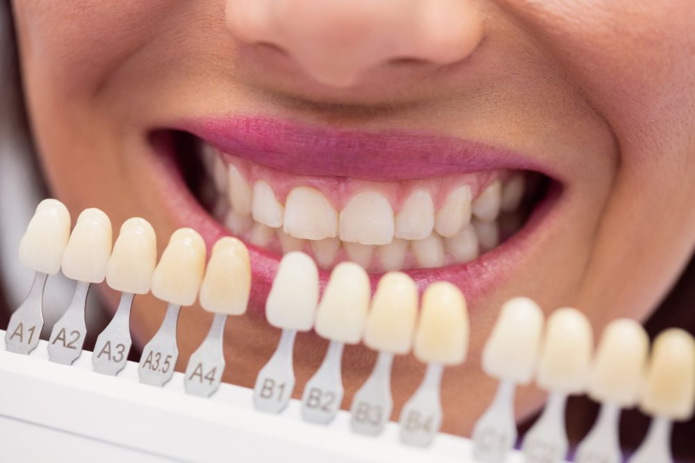 a woman is getting dental treatment.