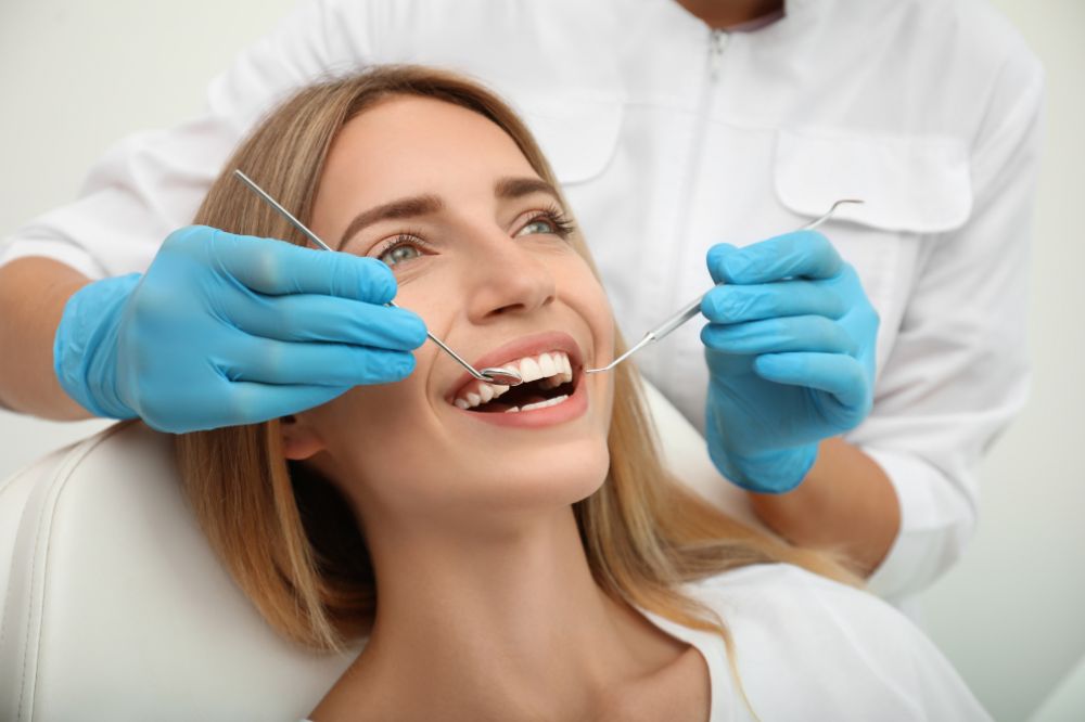 emergency dentist examining a patient